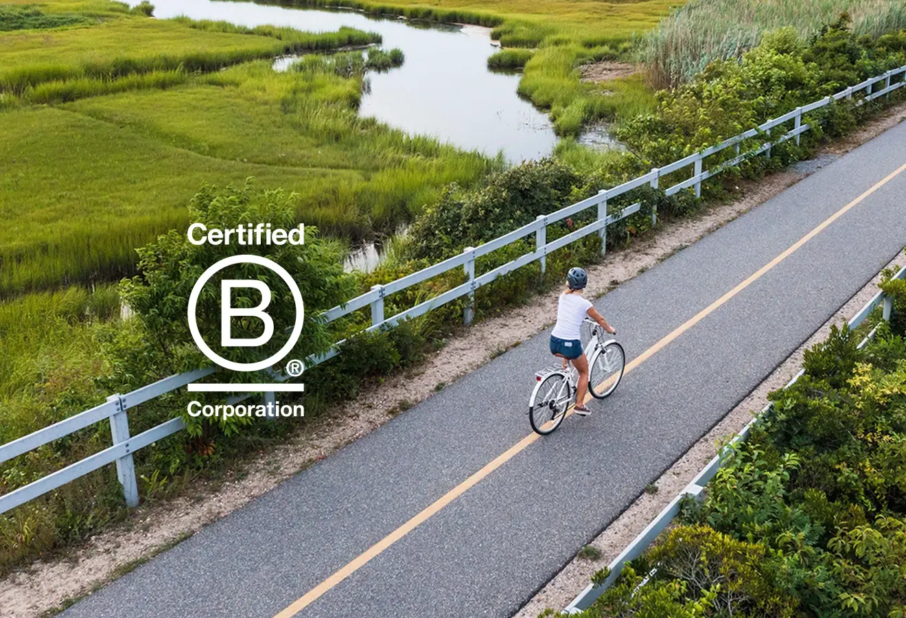 Photograph of the bicyclist on the Shining Sea Bikeway with a B Corp logo on the image.
